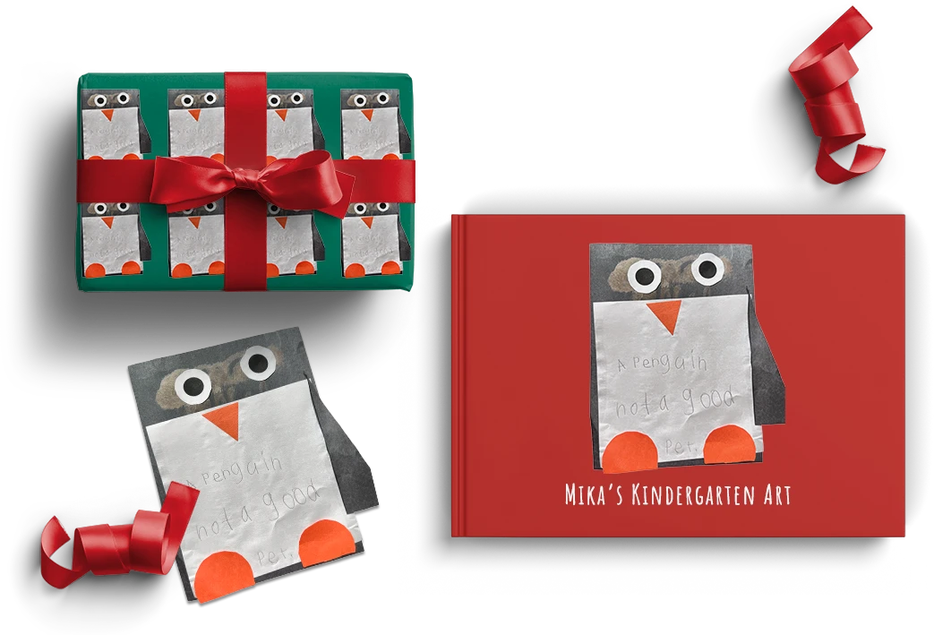A Scribble book and present wrapped with personalized gift wrap made from a child's penguin artwork